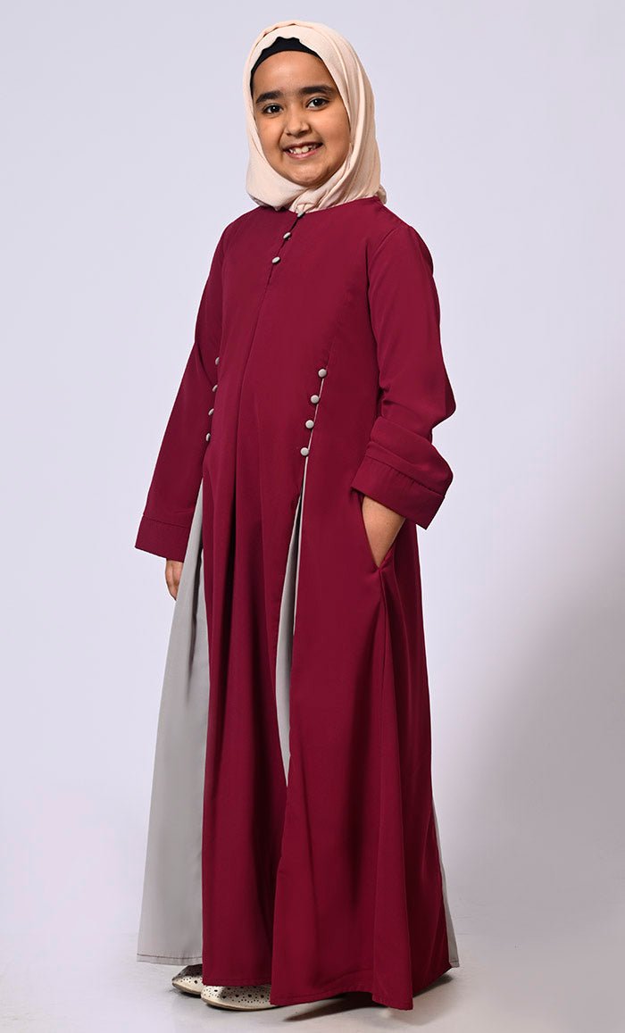 Pleated Perfection: Girl's Maroon Abaya with buttons detailing & Side Pockets